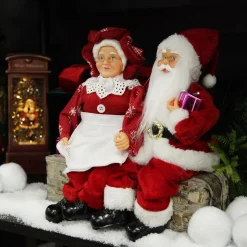 Mr & Mrs Claus with Presents Sitting on Log Christmas Ornament Flash Sale