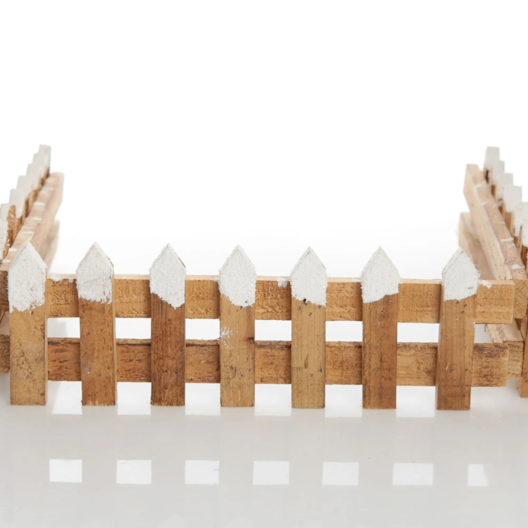 Short Snow Capped Natural Wooden Picket Fence Store