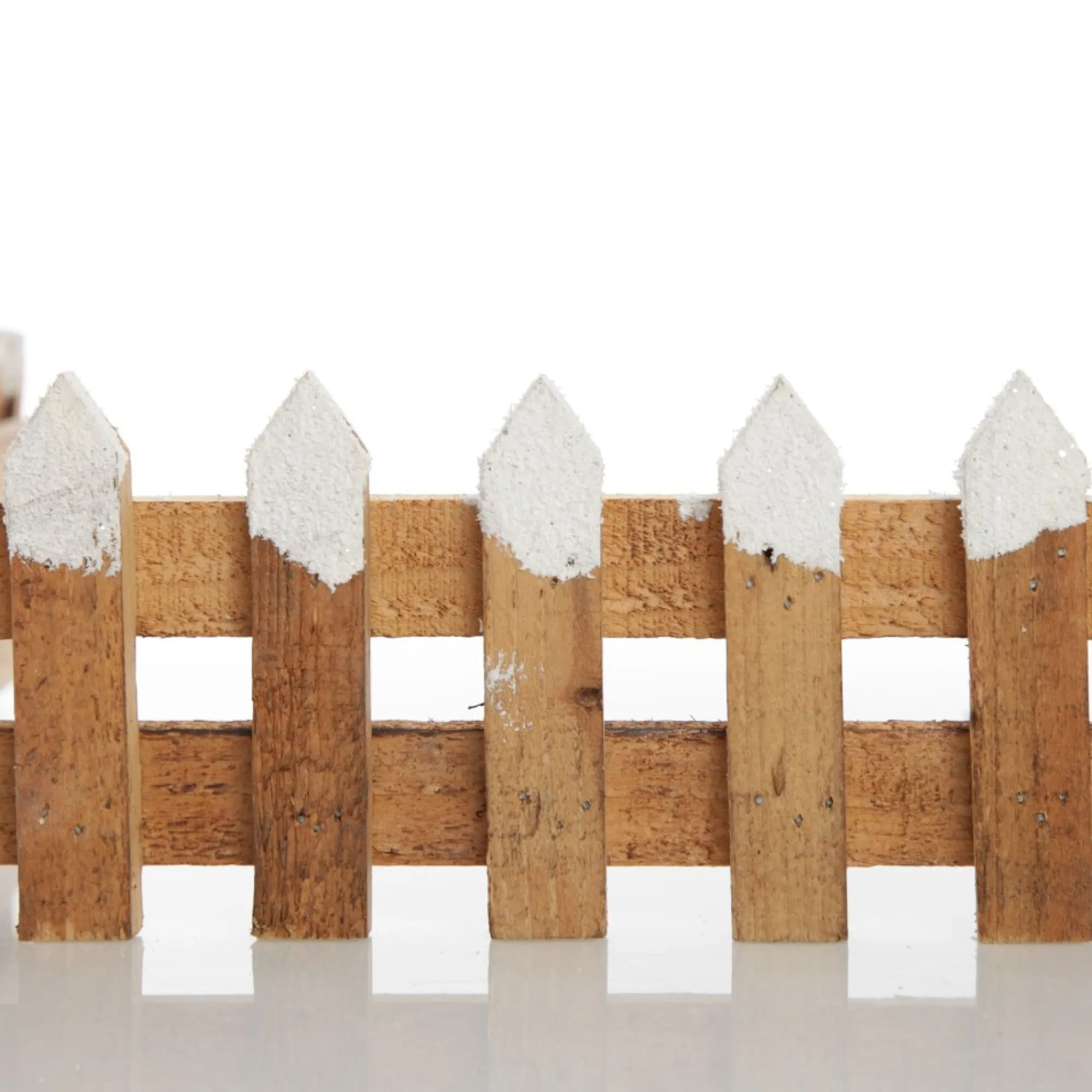 Short Snow Capped Natural Wooden Picket Fence Store