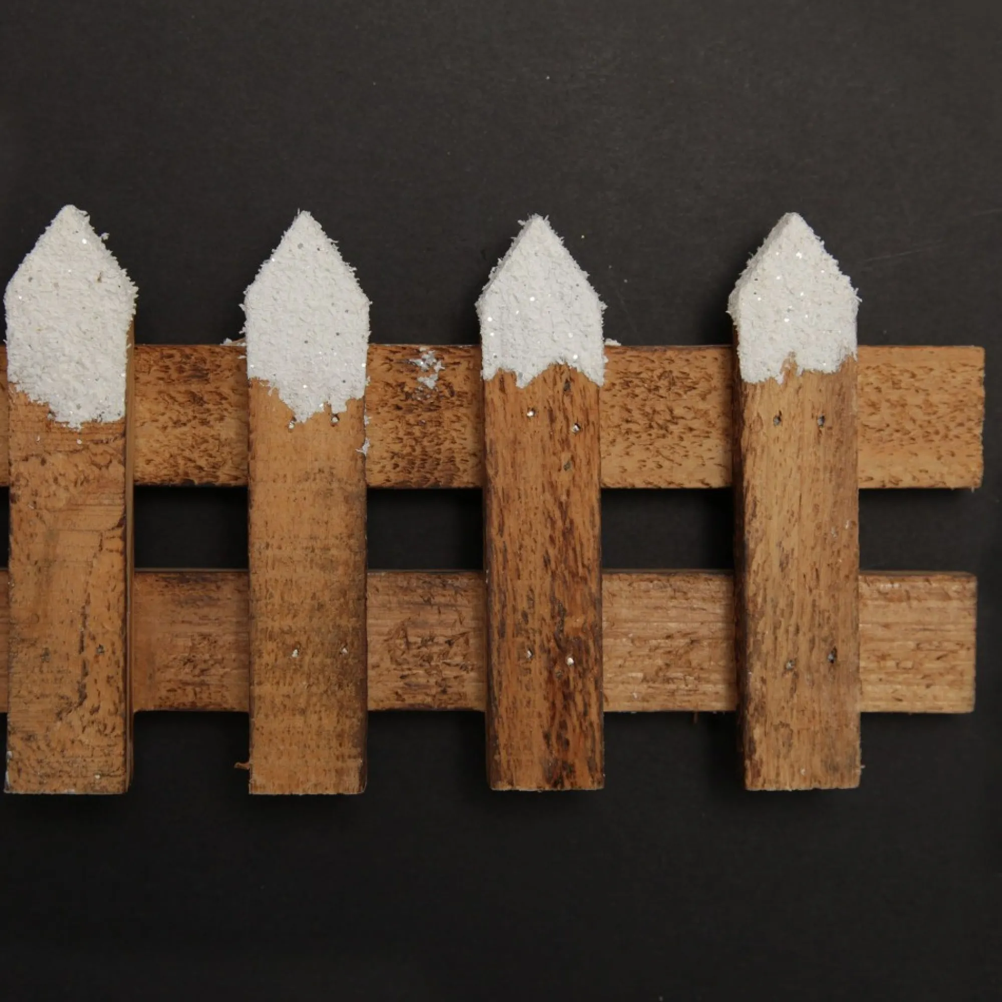 Short Snow Capped Natural Wooden Picket Fence Store