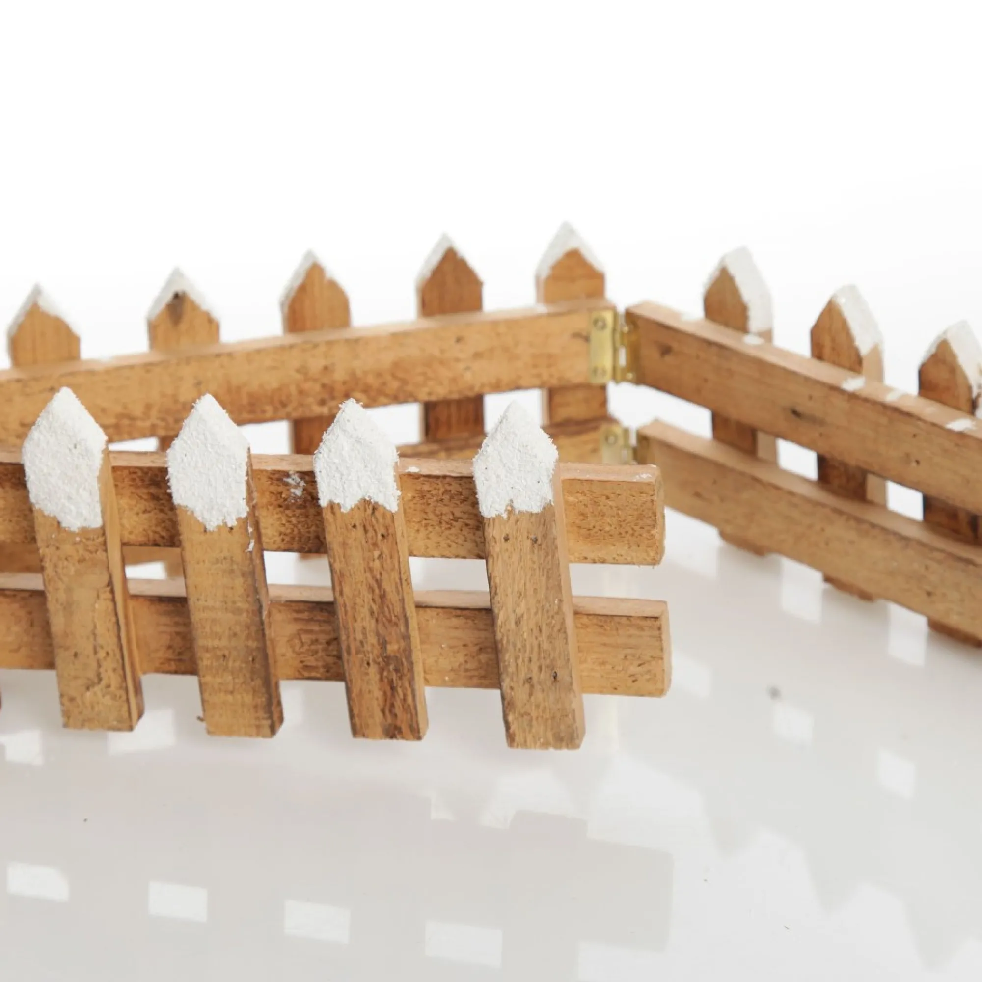 Short Snow Capped Natural Wooden Picket Fence Store