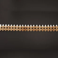Short Snow Capped Natural Wooden Picket Fence Store
