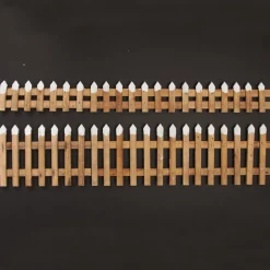 Short Snow Capped Natural Wooden Picket Fence Store
